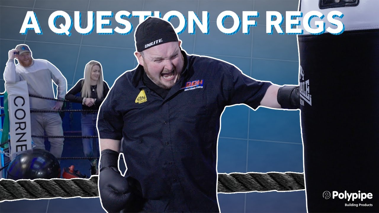A YouTube thumbnail for the digital series "A QUESTION OF REGS" features Pointy Plumber aggressively punching a black heavy bag inside a boxing ring. Pointy is shown in the foreground with an intense, shouting expression, wearing a black "UNILITE" cap and black boxing gloves. In the background, Stanley and Fiona are visible, leaning against the boxing ring ropes and watching the action. The image includes the large title "A QUESTION OF REGS" at the top and the Polypipe Building Products logo in the bottom right corner, all set against a blue grid-patterned background.